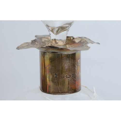 75 - A silver collared pinch glass decanter, Birmingham 1904, together with a silver plated replica of a ... 