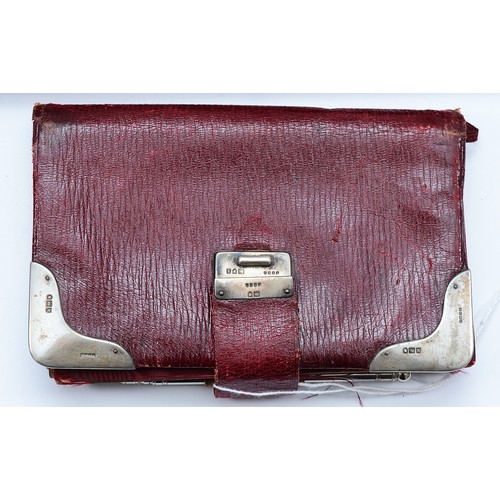 76 - A leather bound note book, having a silver fastening clasp, London 1904, and corners, London 1905, 1... 