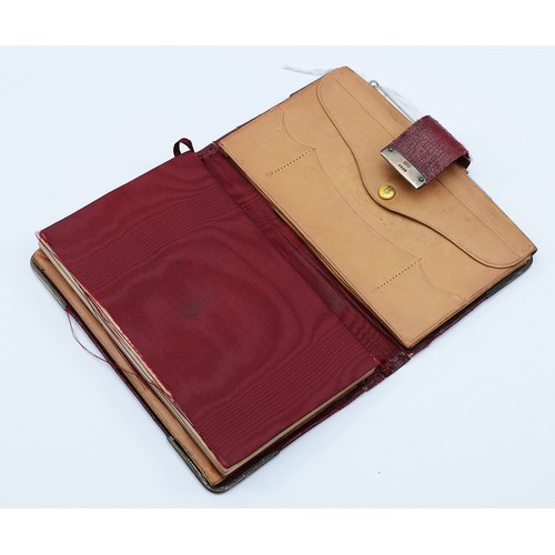 76 - A leather bound note book, having a silver fastening clasp, London 1904, and corners, London 1905, 1... 