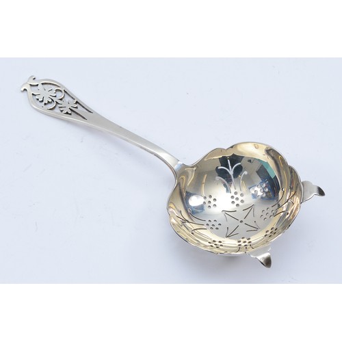 78 - A silver tea strainer, Sheffield 1951, by Viner's Ltd, having pierced bowl and terminal, 43gm, 15cm.
