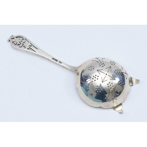 78 - A silver tea strainer, Sheffield 1951, by Viner's Ltd, having pierced bowl and terminal, 43gm, 15cm.