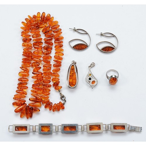 99 - A 925 silver clasped amber necklace, a 925 silver amber panel bracelet, two 925 silver amber pendant... 