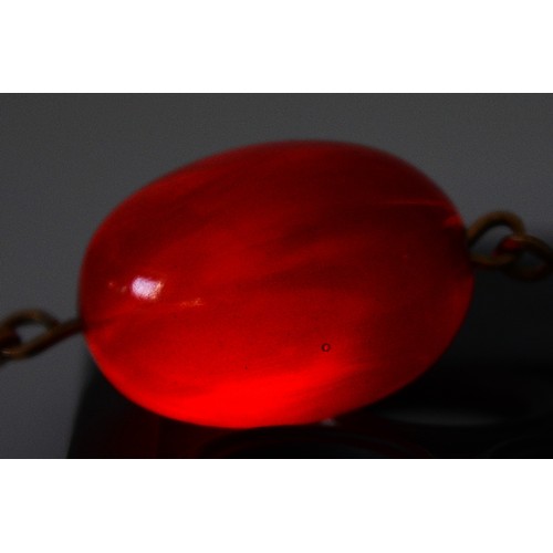 100 - A cherry Bakelite beaded necklace, largest bead 20mm, 46cm, 19g