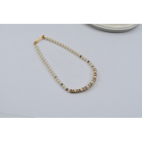 101 - Christian Dior, an imitation pearl and gemset necklace, with box, 36g