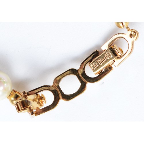 101 - Christian Dior, an imitation pearl and gemset necklace, with box, 36g