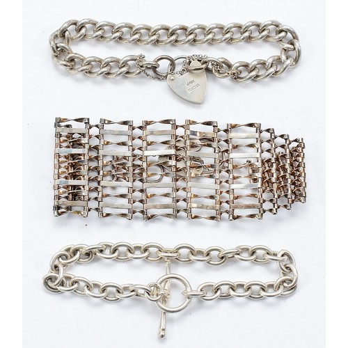 110 - A silver curb link bracelet with heart padlock clasp, Birmingham 1971, a 925 silver gate link bracel... 
