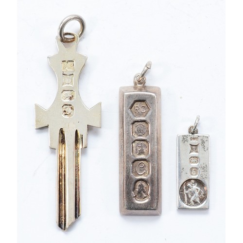 115 - A silver ingot pendant, Birmingham 1979, a silver ingot key pendant, Birmingham 1978 and a silver in... 