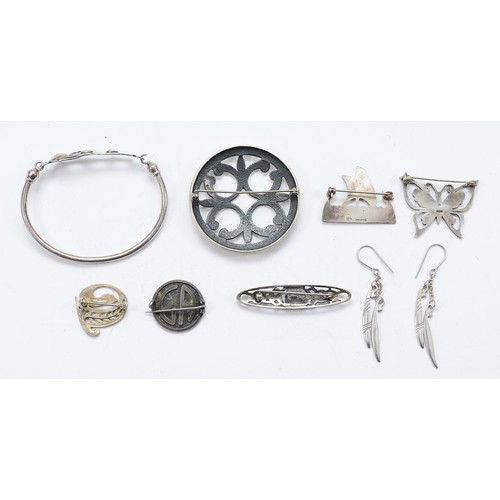 119 - Ola Gorie, a silver grouse brooch, two Scottish silver brooches, two silver brooches, an unmarked si... 