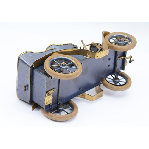 27 - A vintage brass and tin model of a brass era car cigarette container, green leather seats, lift up r... 