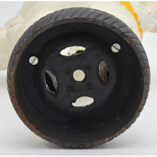 41 - A painted cast iron Michelin man on a wheel, 38cm.