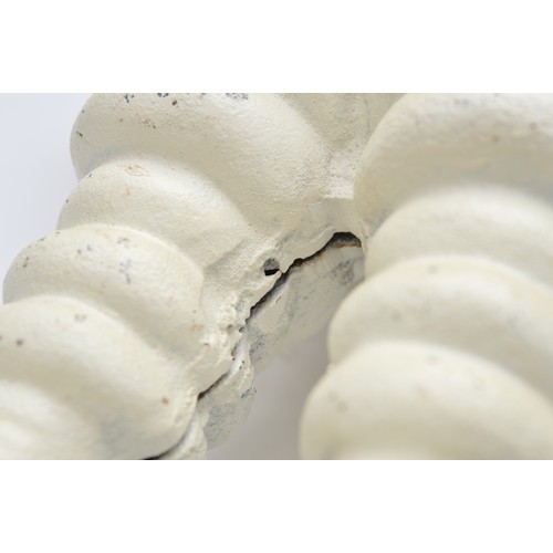 41 - A painted cast iron Michelin man on a wheel, 38cm.