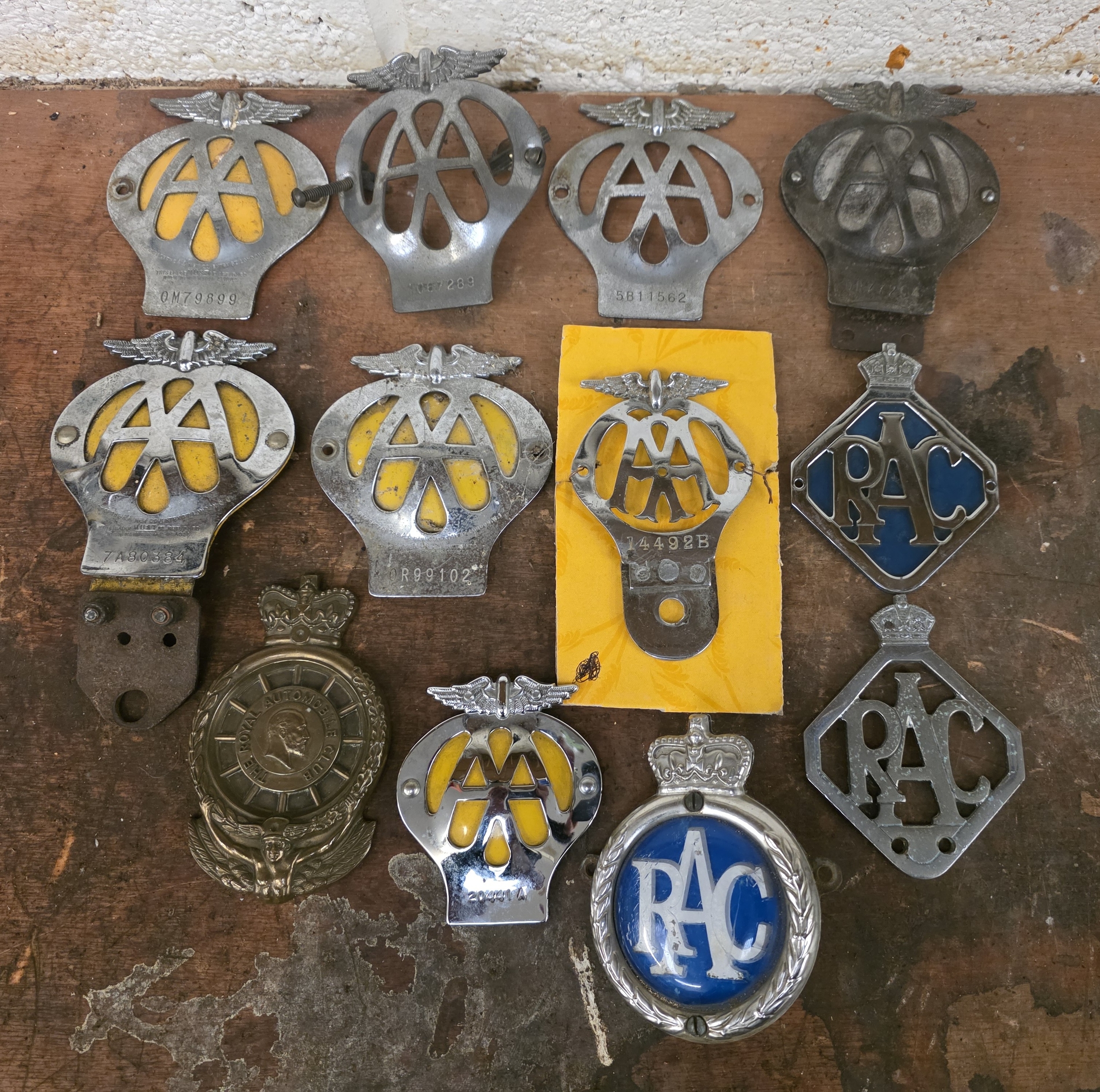 Twelve AA and RAC car badges