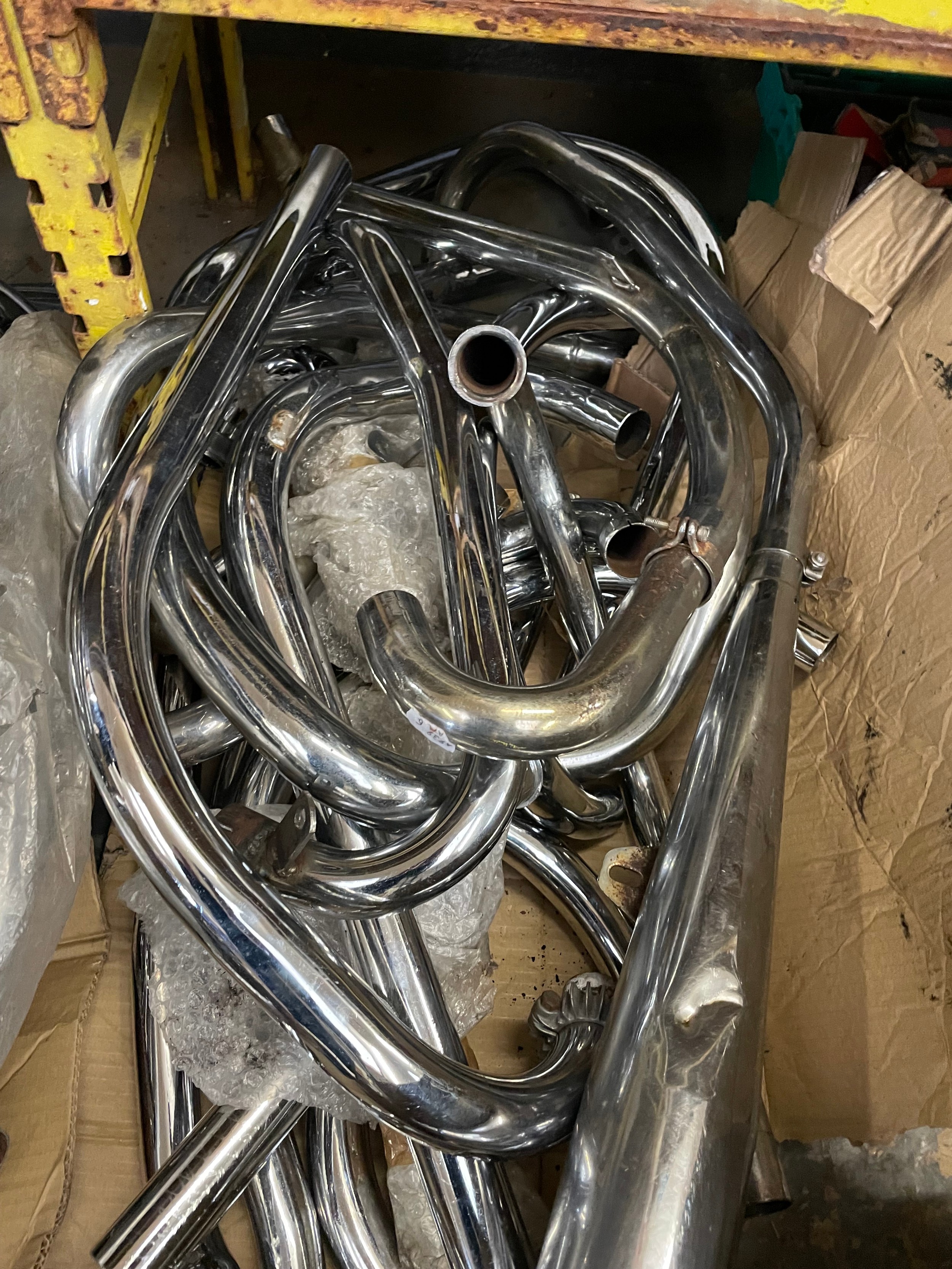 A collection of chrome plated exhaust header pipes for classic ...