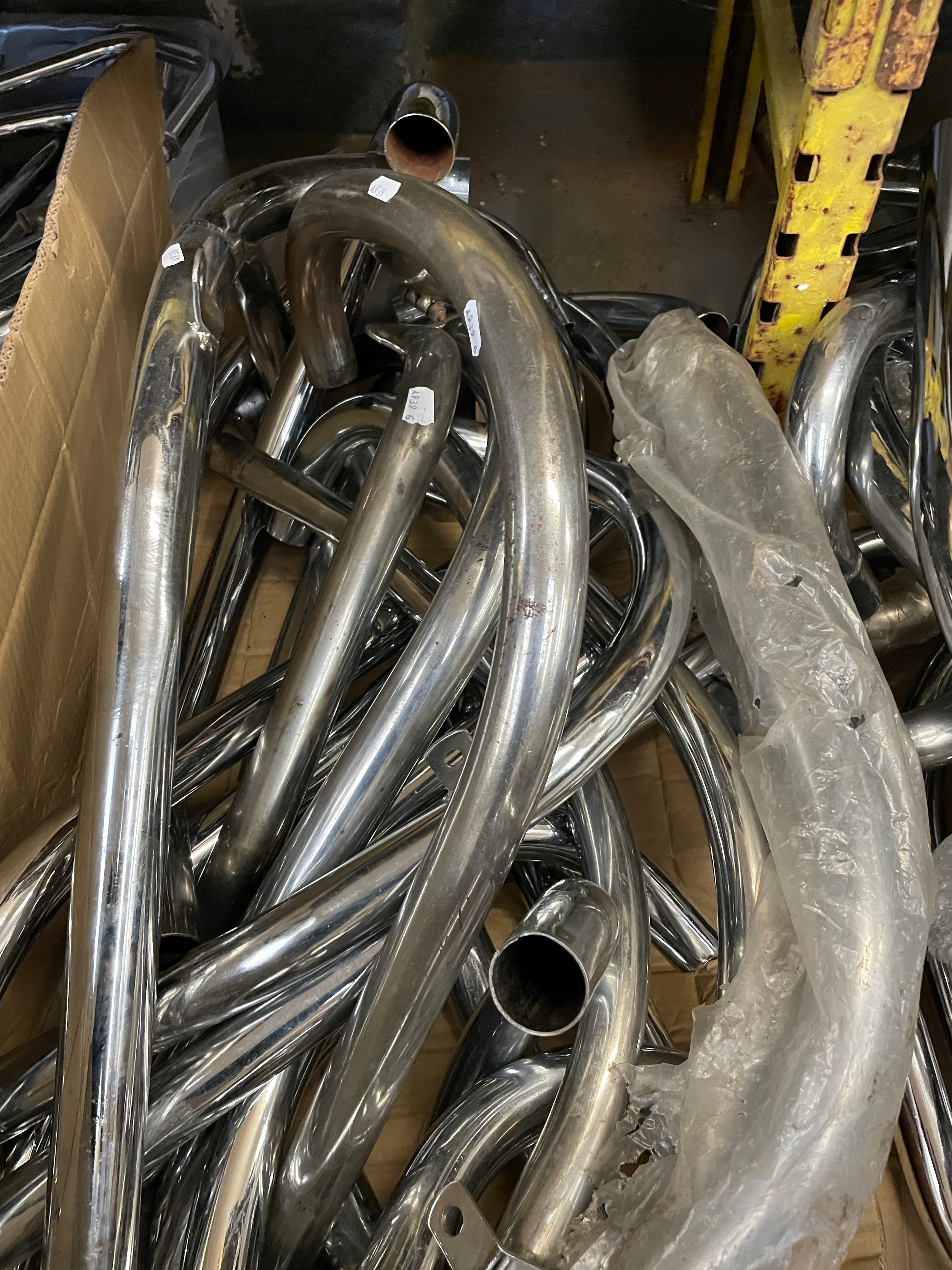 A collection of chrome plated exhaust header pipes for classic ...
