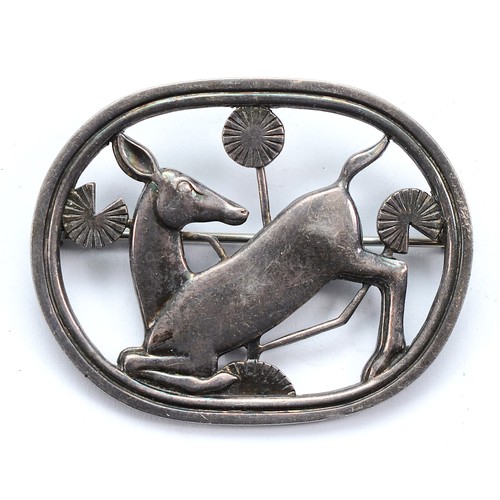 Georg Jensen, a Danish silver brooch of a kneeling deer, design number 256 by Arno Malinowski, 45mm, 14g