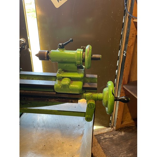 7 - A vintage Myford engineers lathe, manufactured in 1948, mounted on a fabricated steel bench, single ... 