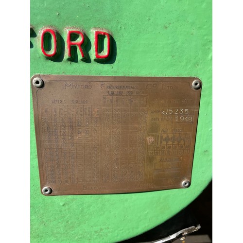 7 - A vintage Myford engineers lathe, manufactured in 1948, mounted on a fabricated steel bench, single ... 