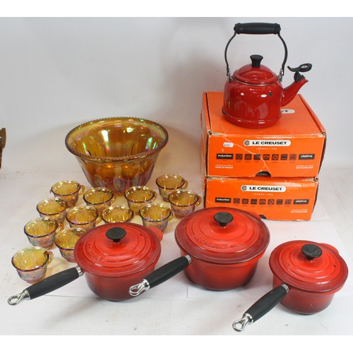51 - A set of three Le Creuset sauce pans, a Le Creuset kettle and a selection of glassware.