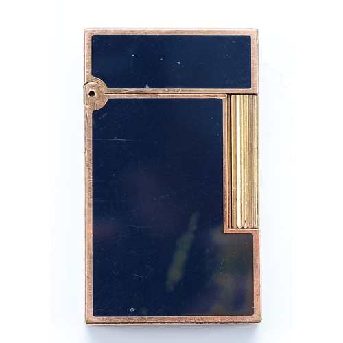 S.T Dupont, Paris; A gents sized Dupont Ligne pocket cigarette lighter, gold tone with Chinese black lacquered panels, stamped to base 'Laque De Chine' 15AGJ37