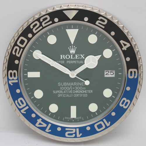 A 'Rolex' style advertising metal wall clock, having quartz movement ...
