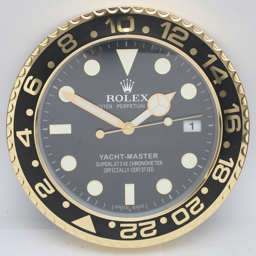 A 'Rolex' style advertising metal wall clock, having quartz movement ...