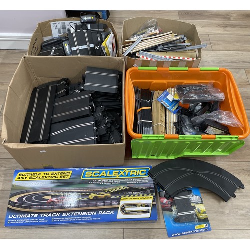 A large amount of Scalextric track, together with Scalextric ...