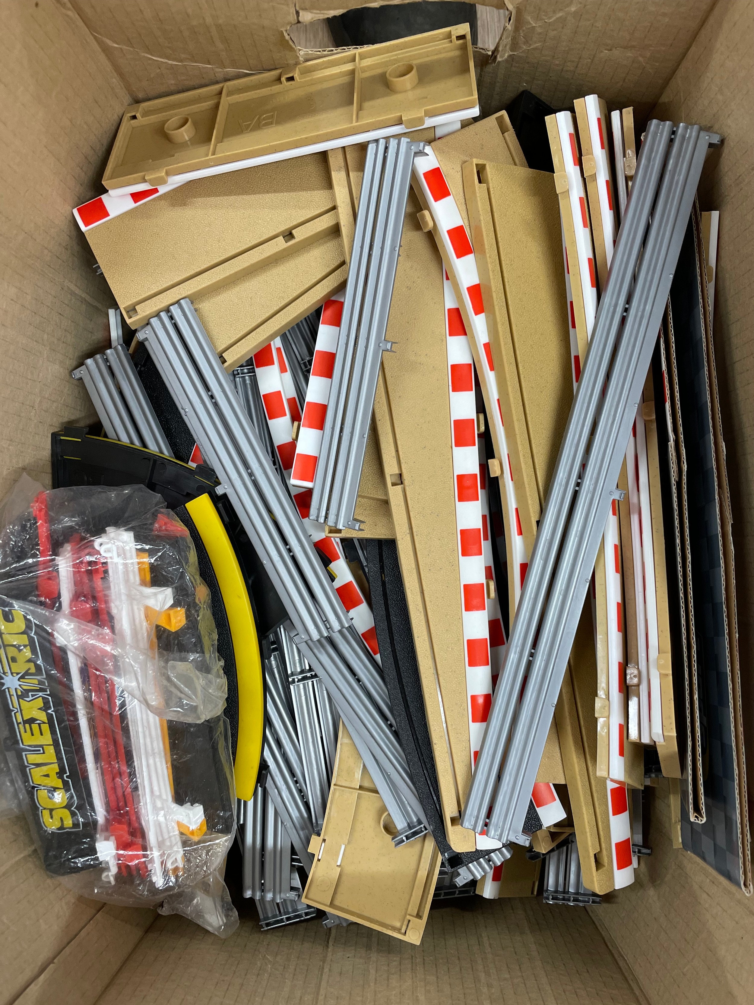 A large amount of Scalextric track, together with Scalextric ...