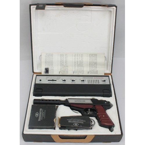 Three gaming related items to include an Amstrad GT65 Monitor, a boxed ...