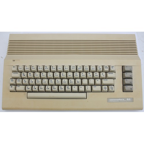 A collection of vintage computers and various electronics, to include a ...