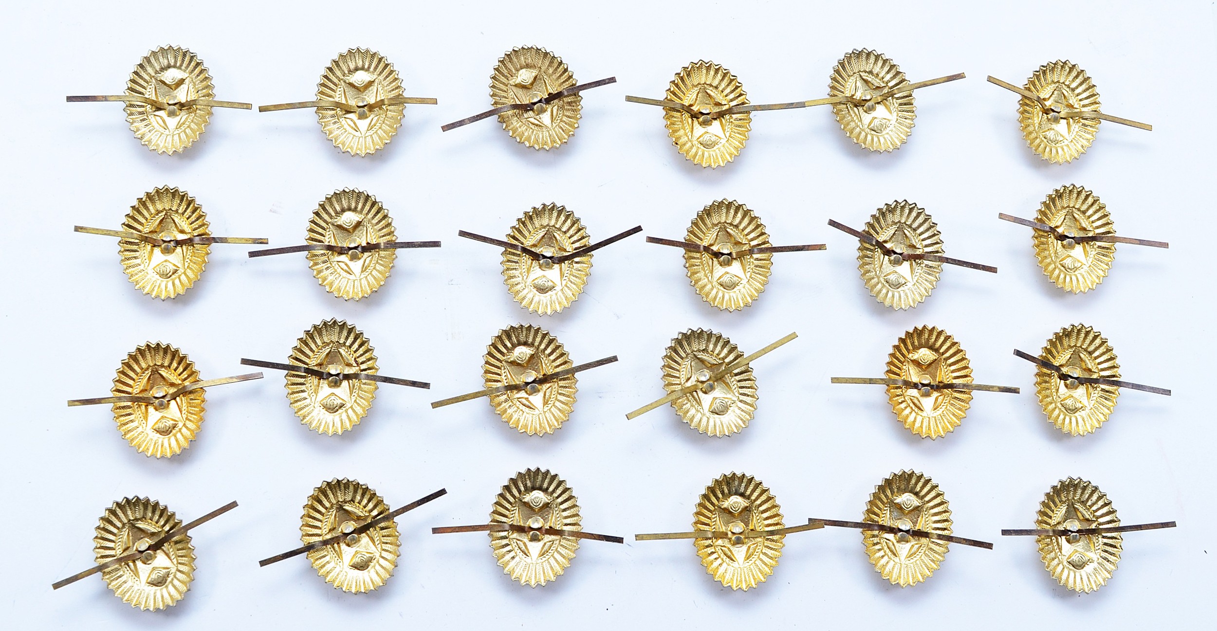 A collection of twenty four USSR Officer's gold toned and enamel ...