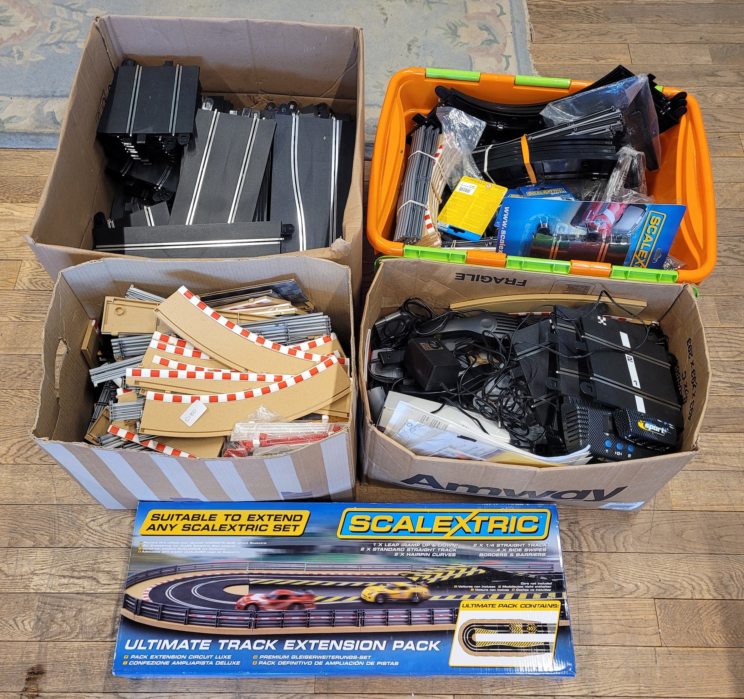 A large amount of Scalextric track, together with Scalextric ...