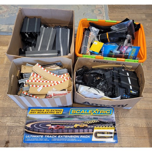 A large amount of Scalextric track, together with Scalextric ...