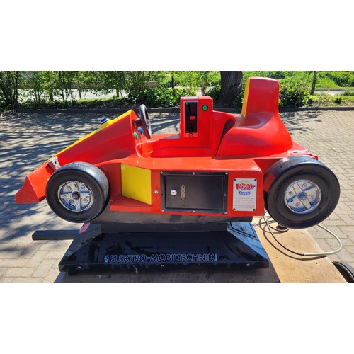 A 1970s coin operated children's ride, styled after a Formula 1 racing ...
