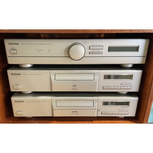 A Technics stack system in a wooden and glass cabinet to include, a ...
