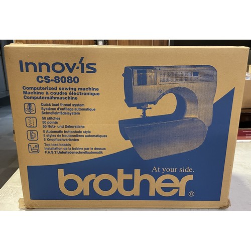 A boxed Brother Innovis CS-8080 computerized sewing machine, appears to ...