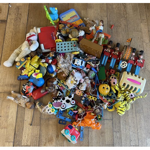 A large collection of assorted vintage and modern toys, including ...