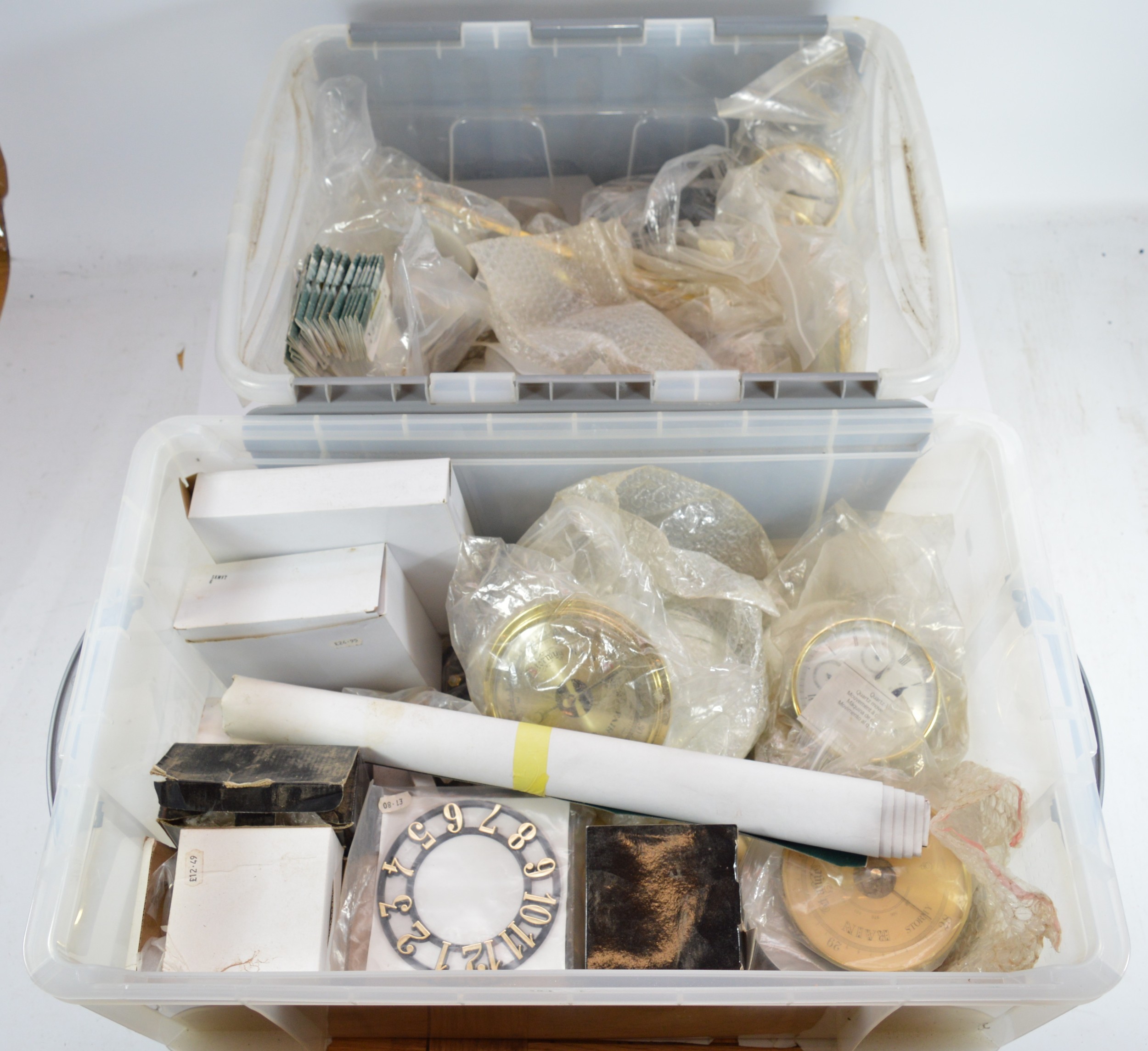 Two boxes of clock and barometer making kits and quartz movements. (2)