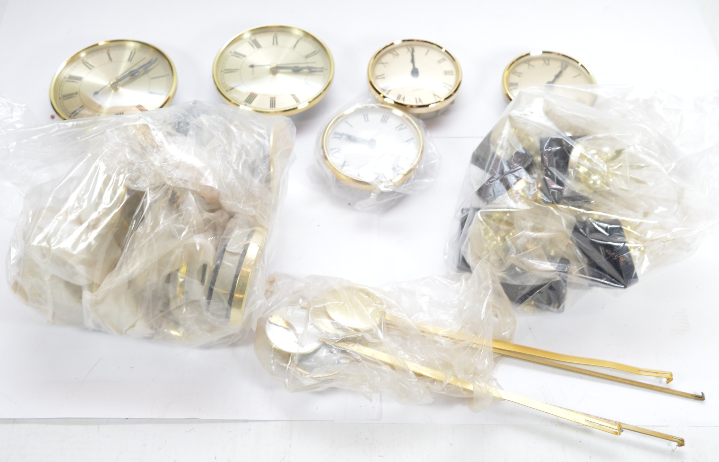 Two boxes of clock and barometer making kits and quartz movements. (2)