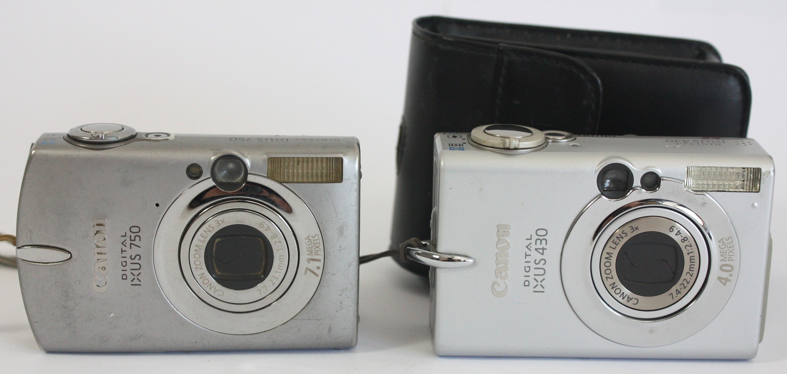 A Canon IXUS 430 digital camera and a Canon IXUS 750 digital camera. (2)
