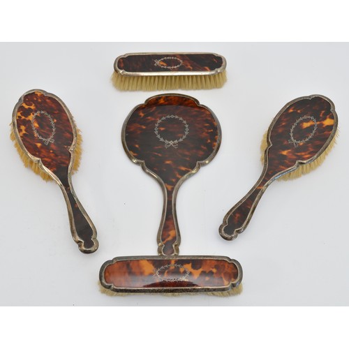 A five piece silver and tortoise shell vanity set, Birmingham 1925, by ...