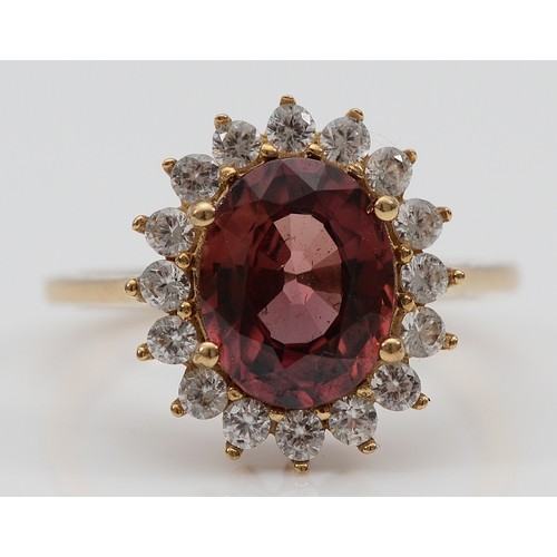 A 9ct gold red and natural zircon cluster ring, M, with TJC certificate ...
