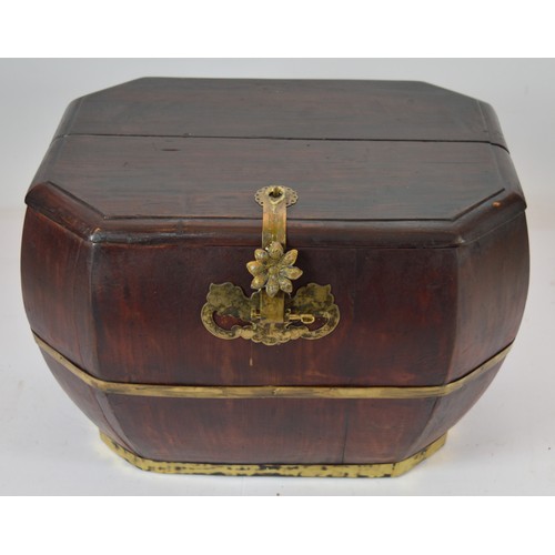 An octagonal wooden box reinforced with brass banding to the base and ...