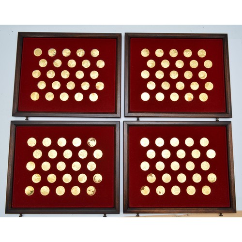 Franklin Mint, The Medallic History of Britain, first edition proof set, number 93, 24ct gold on sterling silver, 100 medals, each weighing 12gm, total 120gm, booklet four drawer cabinet, 52 x 39 x 28cm.