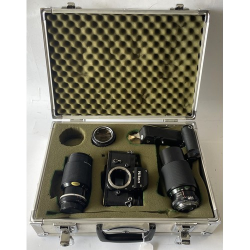A Nikon F2 7431842 film camera, a Nikon Nikkor Zoom 50-135 1:3.5 No. 812088 lens, a Vivitar 75-205mm 1:3.8 MC Zoom No. 22107003 lens together with an aluminium storage case, 6.4kg.