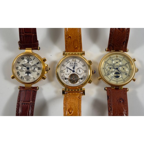 Three R. U. Braun gold plated automatic calendar wristwatches, with sun and moon dials and visible balance dials. (3)