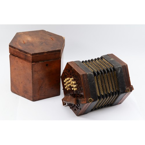 A late 19th century Lachenal & Co of London Maccann Duet concertina, of hexagonal form, rosewood fret-cut end plates, bone buttons, original paper label, in conforming mahogany box.