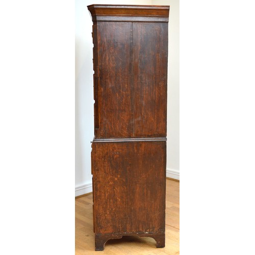  A George III Welsh walnut and oak tallboy, the later moulded cornice above three short and three lon... 