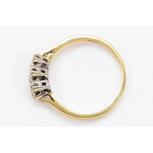 10 - An 18ct gold brilliant cut diamond three stone ring, O, 2.3g