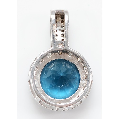 21 - A 9ct white gold topaz and diamond pendant, 10mm topaz, 21mm, 2.6g