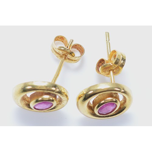 23 - A pair of unmarked 9ct gold pink sapphire earrings with scroll backs, 0.8g